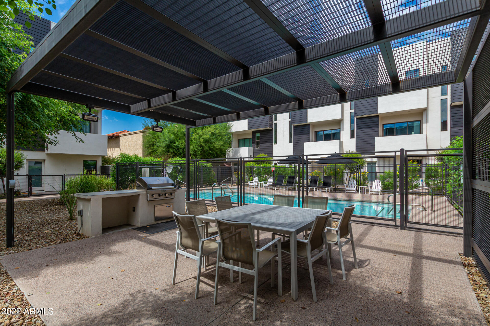 325 East Coronado Road, Unit 16 Phoenix, AZ 85004 - Photo 32 of 36 a patio with table and chairs and potted plants