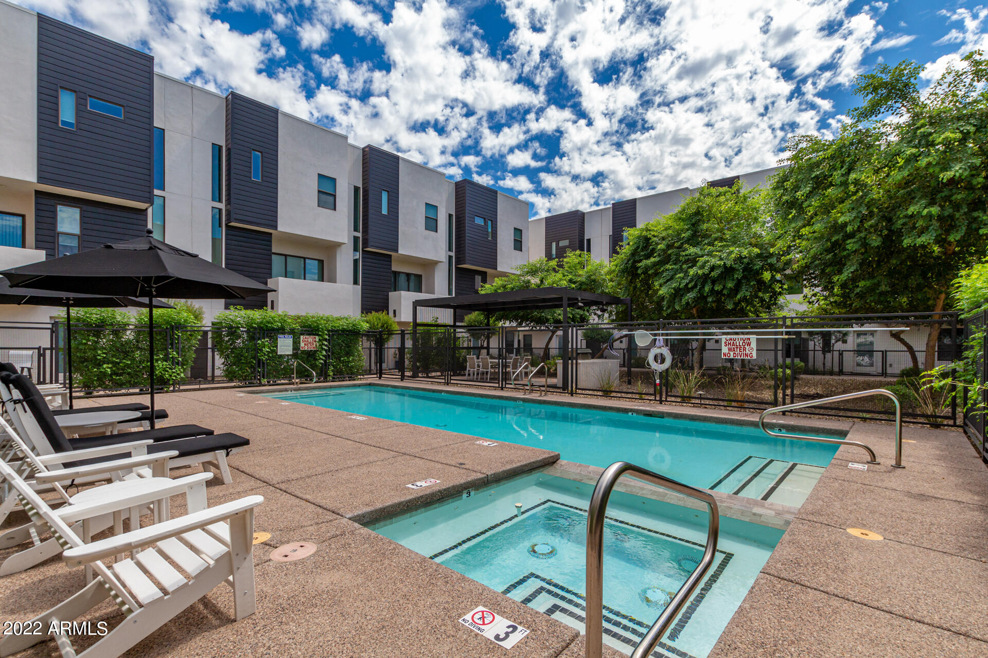 325 East Coronado Road, Unit 16 Phoenix, AZ 85004 - Photo 35 of 36 a front view of a house with garden and sitting area