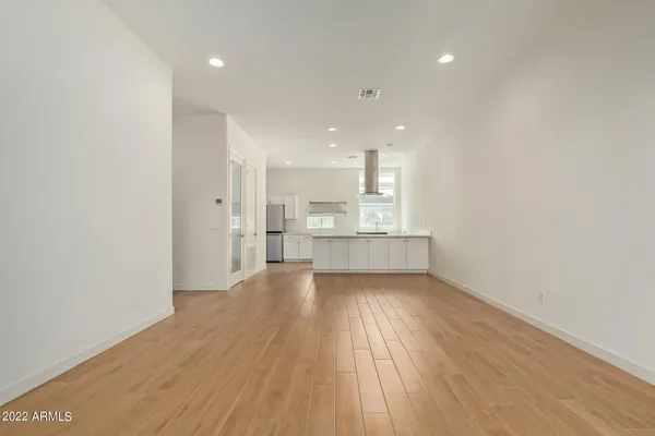 a view of kitchen and wooden floor