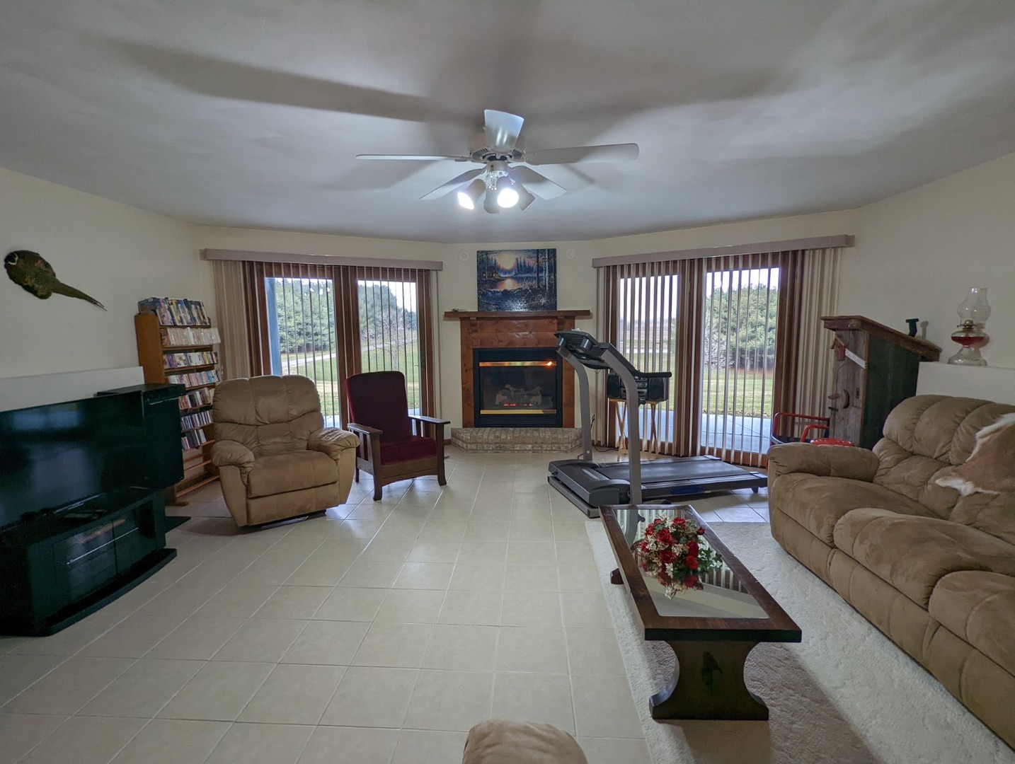 8597 East Winneshiek Road Ridott, IL 61067 - Photo 13 of 49 a living room with furniture and a fireplace