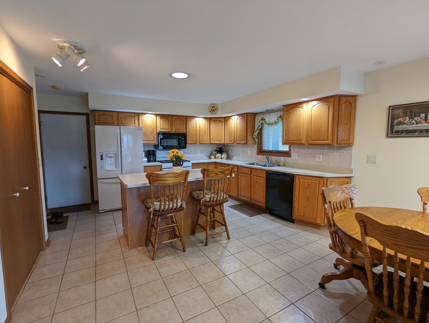 8597 East Winneshiek Road Ridott, IL 61067 - Photo 14 of 49 a kitchen with a table and chairs in it