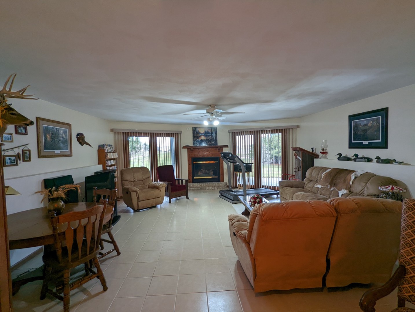 8597 East Winneshiek Road Ridott, IL 61067 - Photo 19 of 49 a living room with furniture and a fireplace