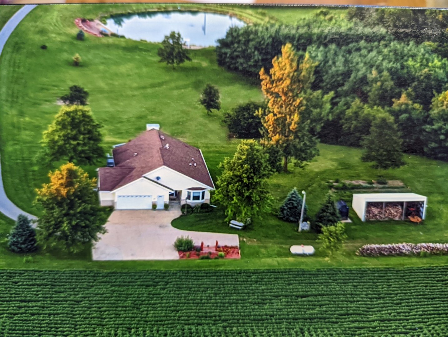 8597 East Winneshiek Road Ridott, IL 61067 - Photo 23 of 49 a view of a house with a yard