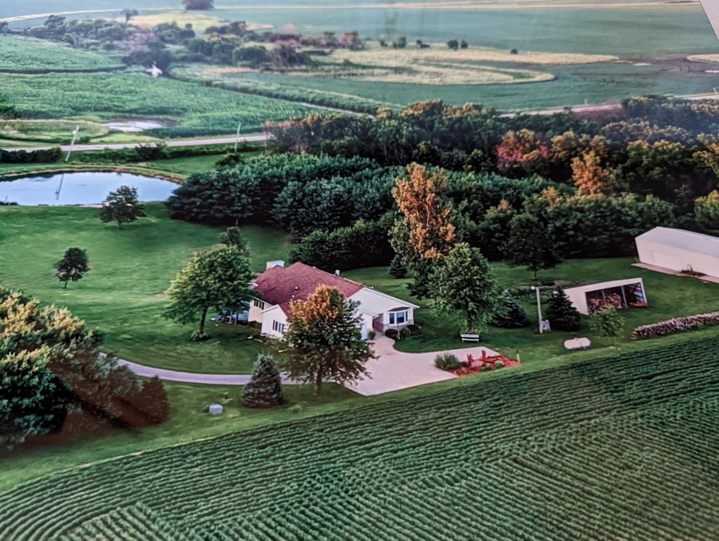 8597 East Winneshiek Road Ridott, IL 61067 - Photo 24 of 49 a garden view with a lake view