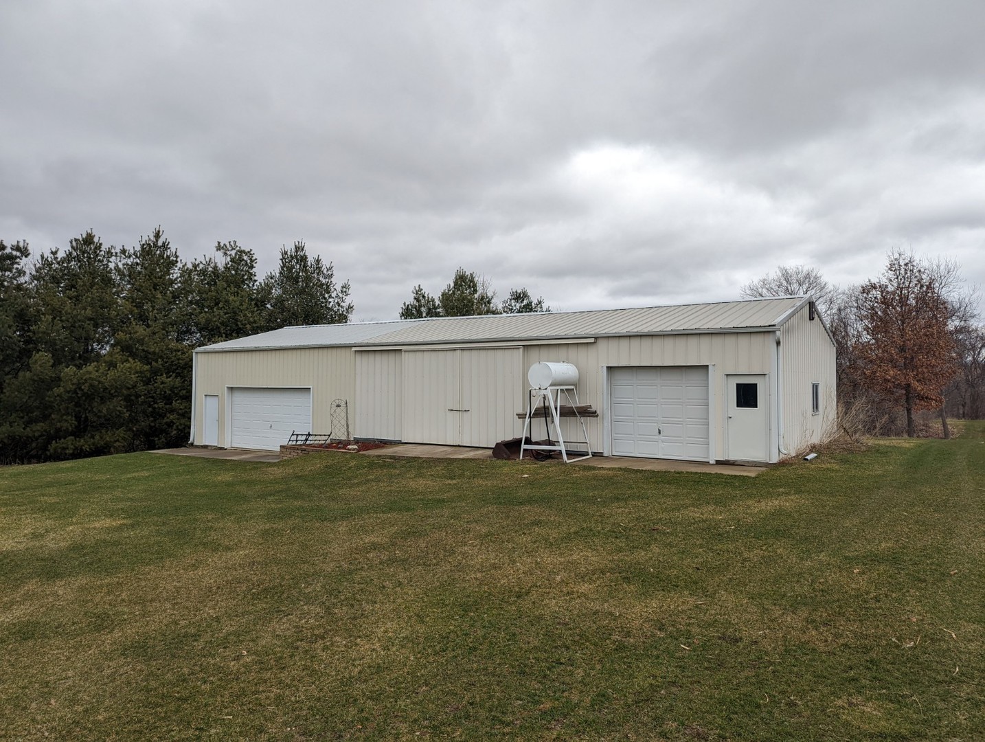 8597 East Winneshiek Road Ridott, IL 61067 - Photo 25 of 49 a view of a house with a yard