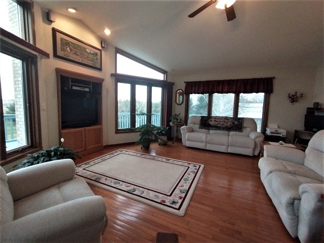 8597 East Winneshiek Road Ridott, IL 61067 - Photo 30 of 49 a living room with furniture rug and window