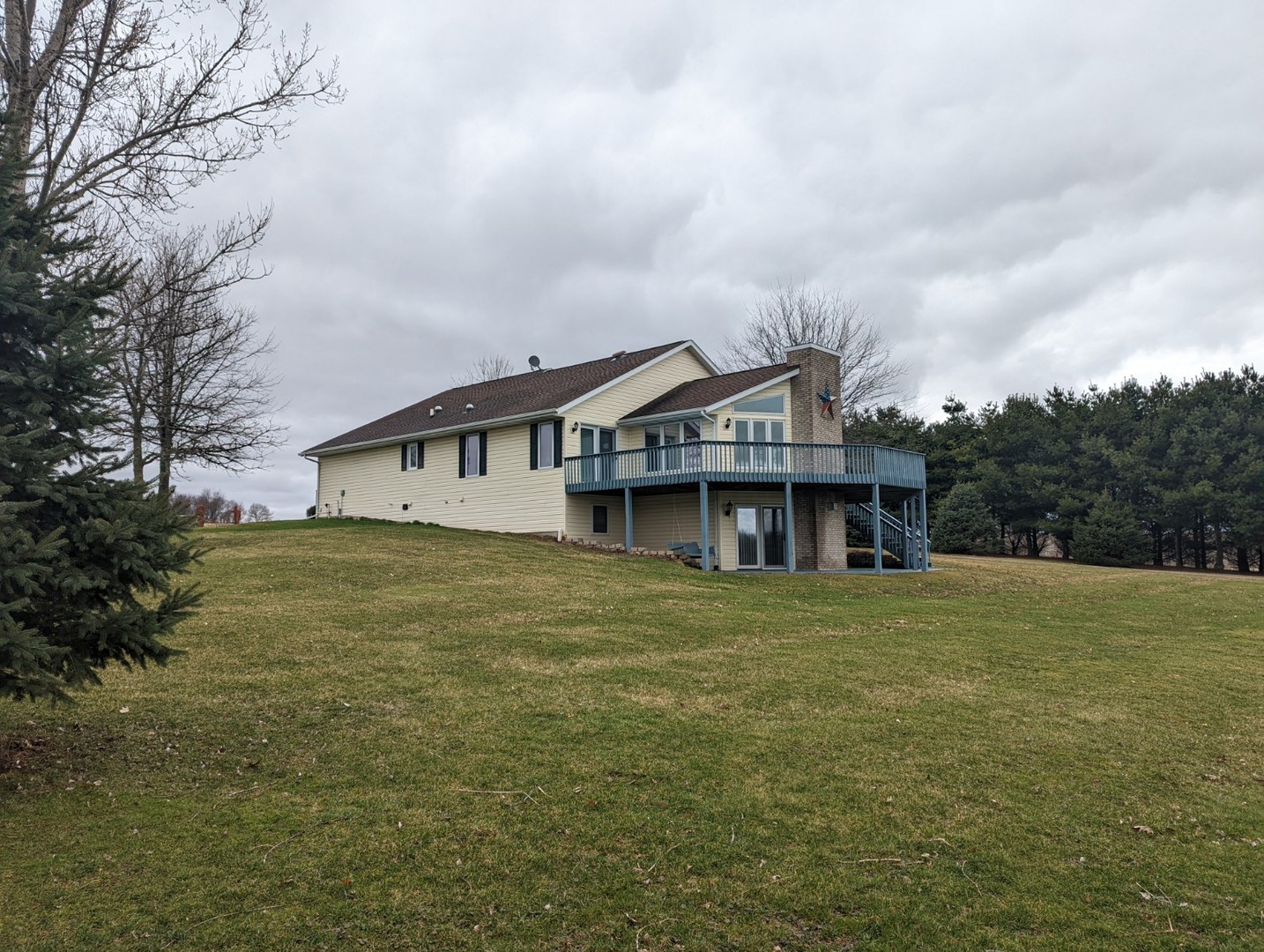 8597 East Winneshiek Road Ridott, IL 61067 - Photo 3 of 49 a house with huge green field in front of it