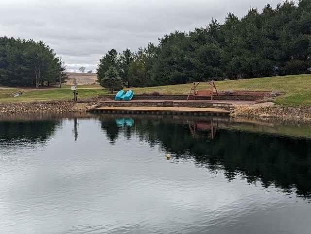 8597 East Winneshiek Road Ridott, IL 61067 - Photo 32 of 49 a view of a lake with a yard