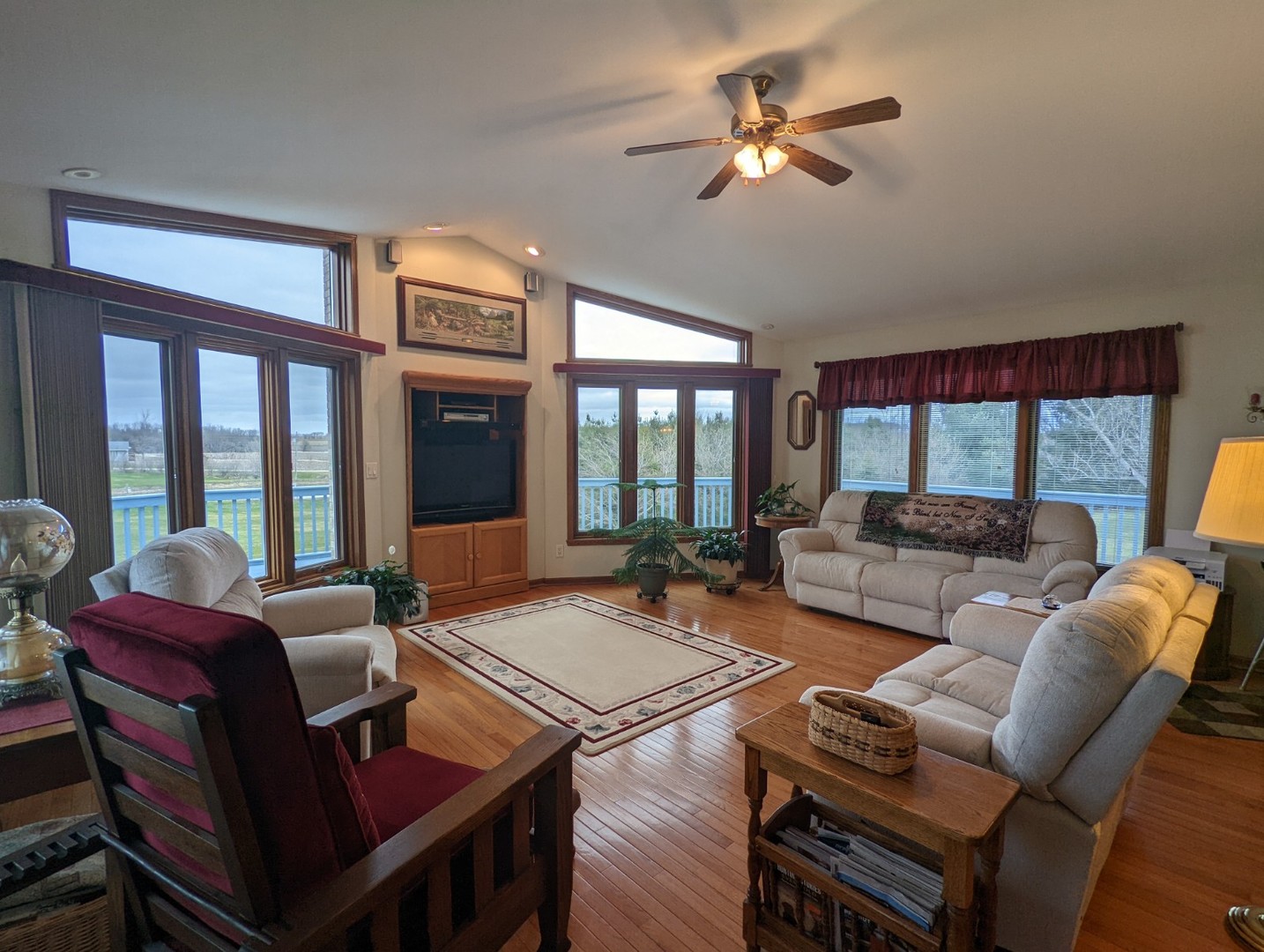 8597 East Winneshiek Road Ridott, IL 61067 - Photo 37 of 49 a living room with furniture a table and a large window