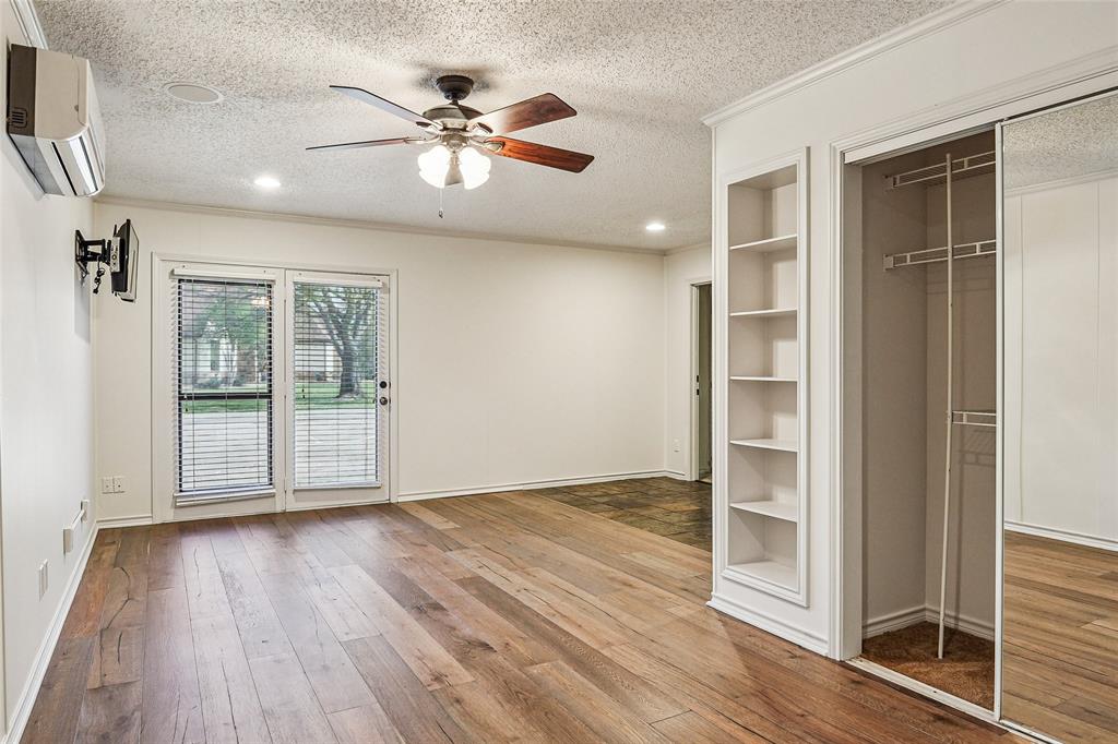 1006 Cochran Road Argyle, TX 76226 - Photo 27 of 40 an empty room with wooden floor and windows