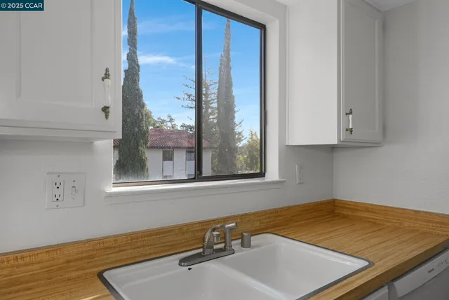 a bathroom with a sink and a window