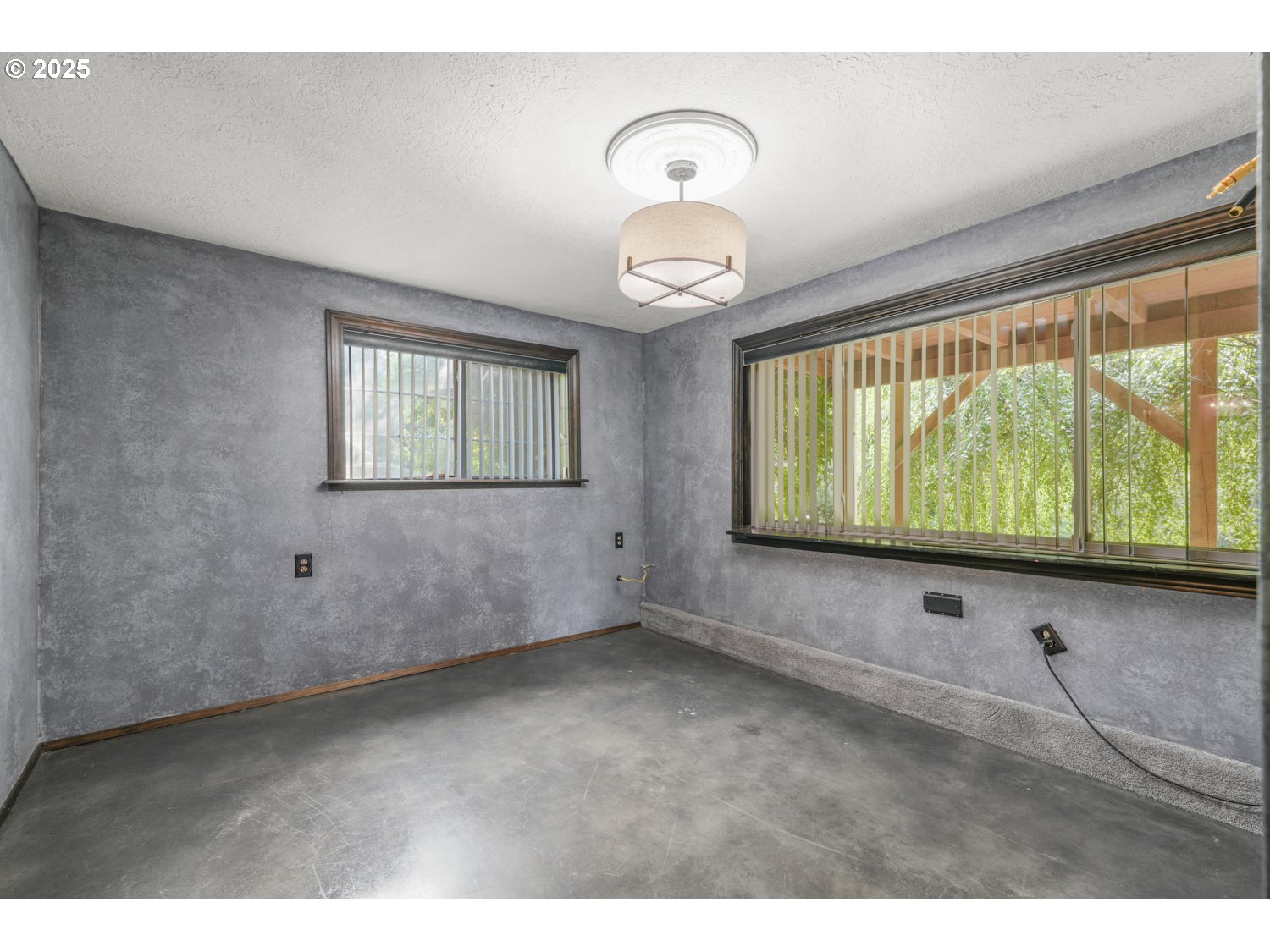 15145 Southeast Anderson Road Damascus, OR 97089 - Photo 16 of 34 a view of an empty room with wooden floor and windows