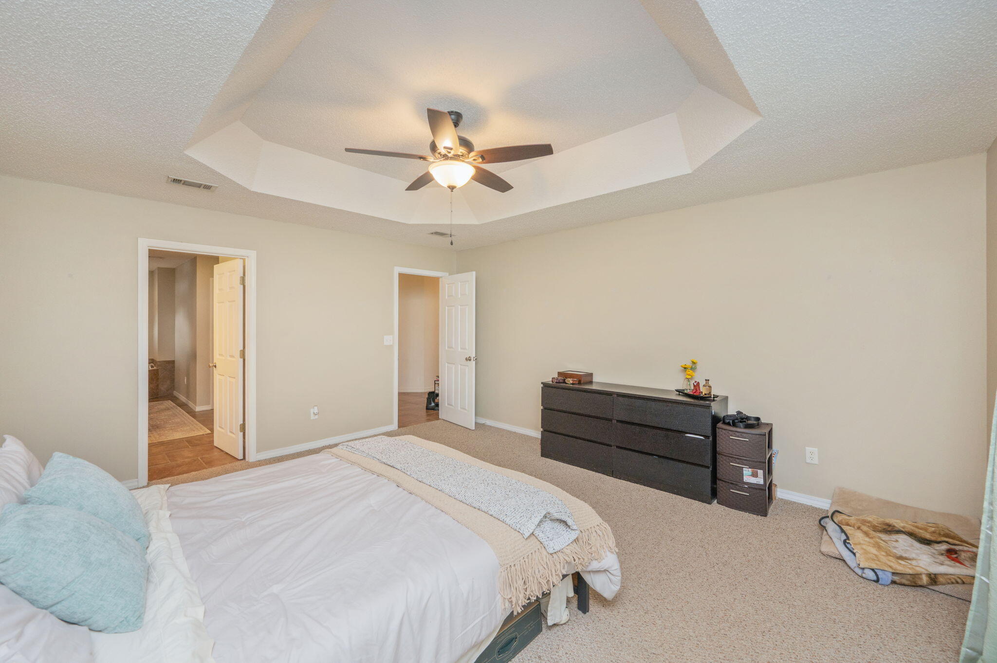 109 Tranquility Drive Crestview, FL 32536 - Photo 21 of 41 a bed room with a bed and a chandelier