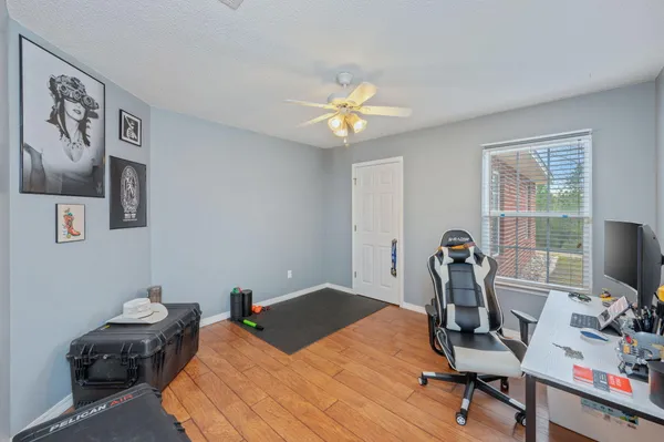 a bedroom with a workspace