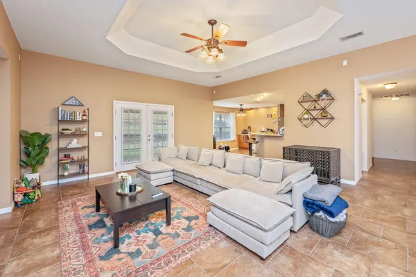 a living room with furniture and a large window