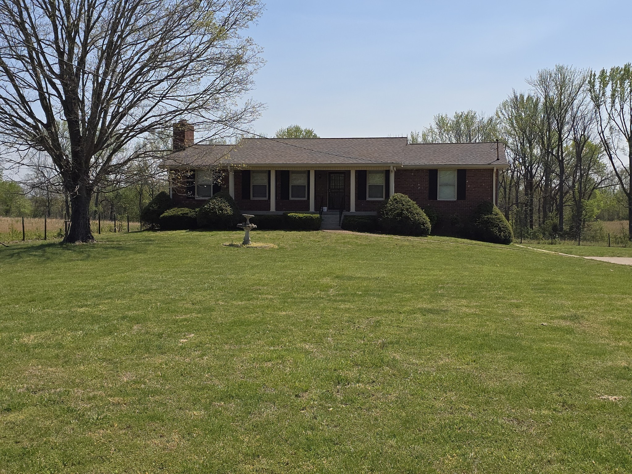6350 Eatons Creek Road Joelton, TN 37080 - Photo 1 of 37 a front view of a house with yard and trees