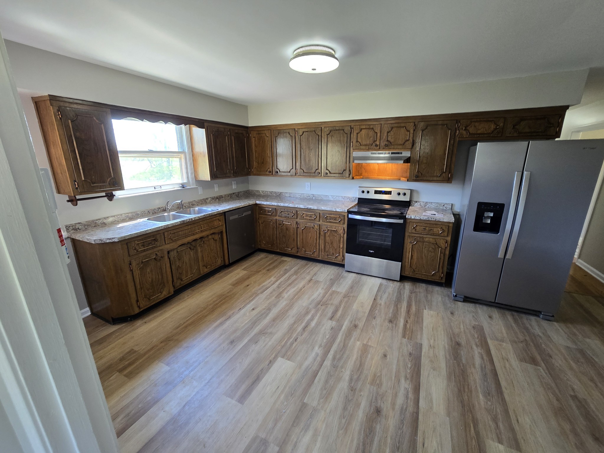 6350 Eatons Creek Road Joelton, TN 37080 - Photo 17 of 37 a kitchen with stainless steel appliances granite countertop a stove a refrigerator a sink and a oven