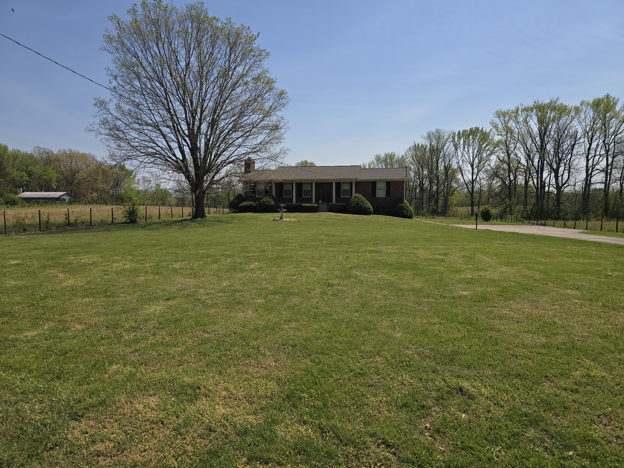 6350 Eatons Creek Road Joelton, TN 37080 - Photo 2 of 37 a front view of house with yard and trees