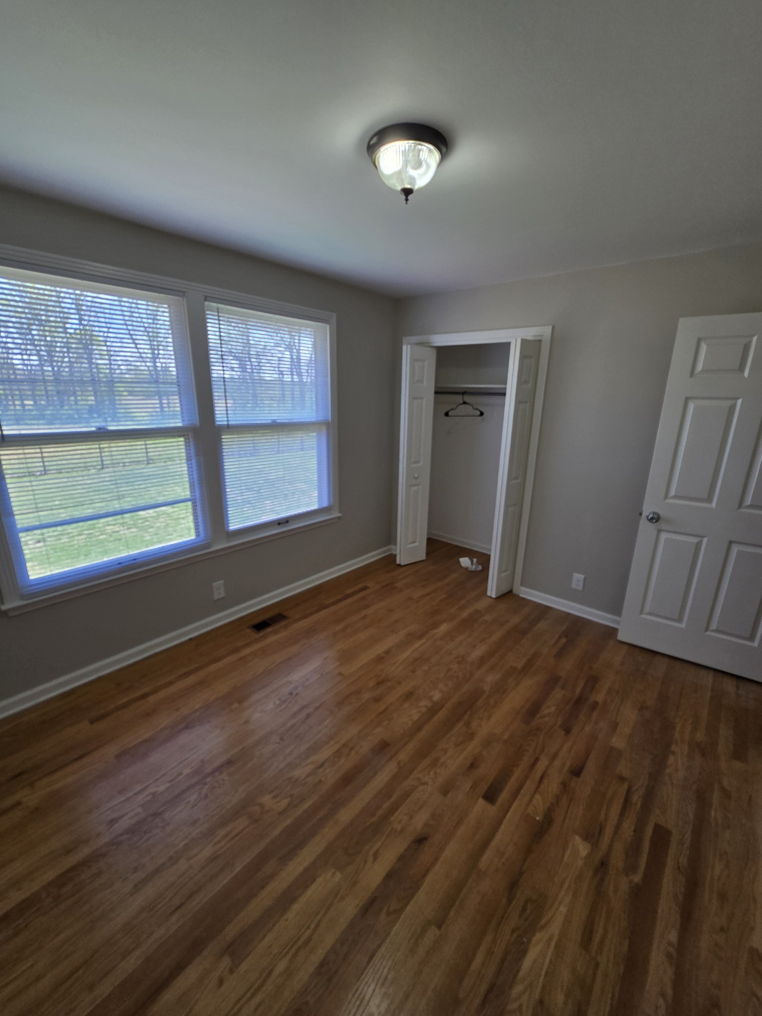 6350 Eatons Creek Road Joelton, TN 37080 - Photo 21 of 37 a view of an empty room with wooden floor and a window