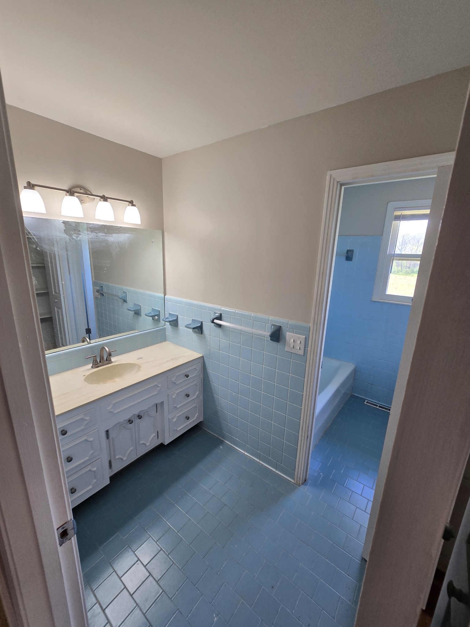 6350 Eatons Creek Road Joelton, TN 37080 - Photo 22 of 37 a bathroom with a double vanity sink and mirror