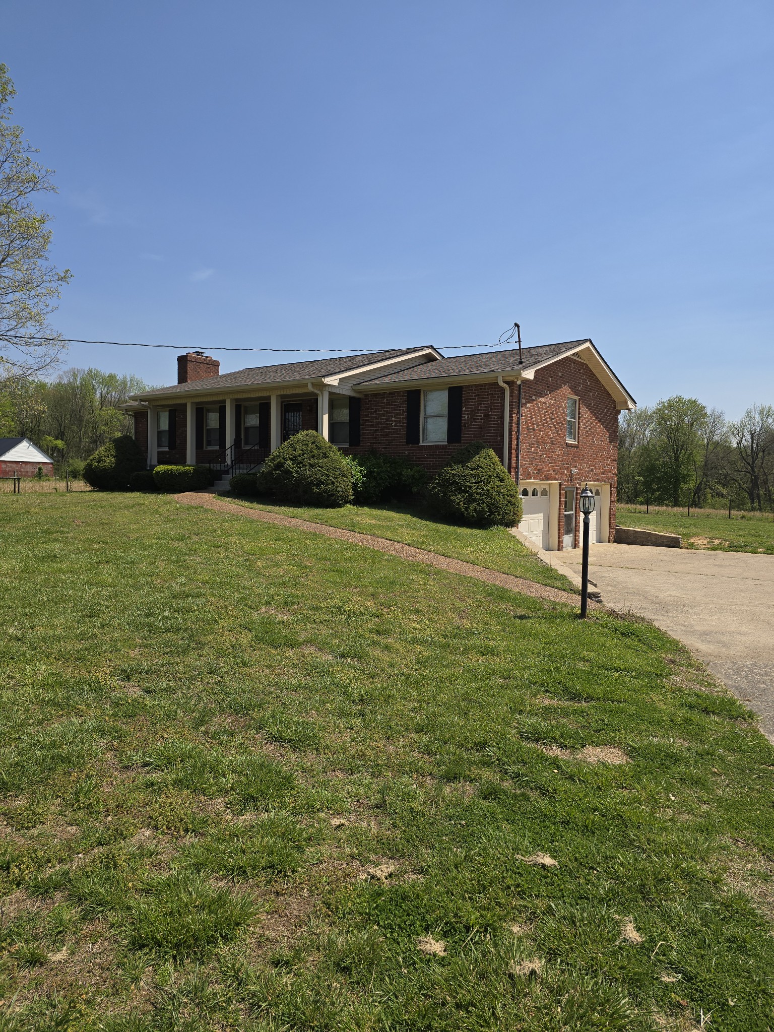 6350 Eatons Creek Road Joelton, TN 37080 - Photo 6 of 37 a house view with a garden space