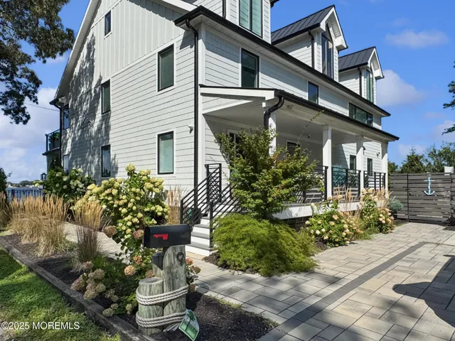 a view of a house with backyard and wooden floor