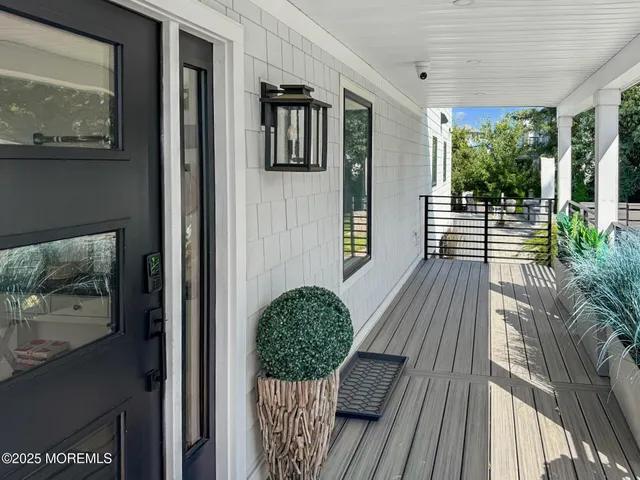 a living room with furniture a couch and a large window