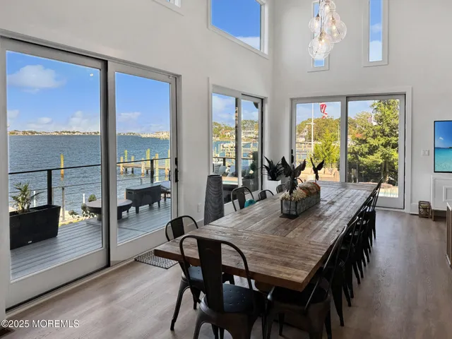 a living room with furniture windows and a flat screen tv