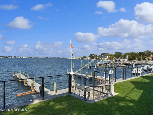 a view of a lake with outdoor seating