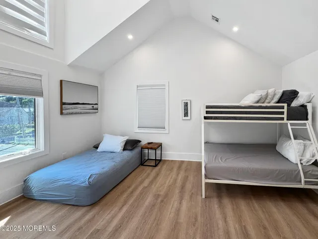 a bathroom with a double vanity sink mirror and toilet