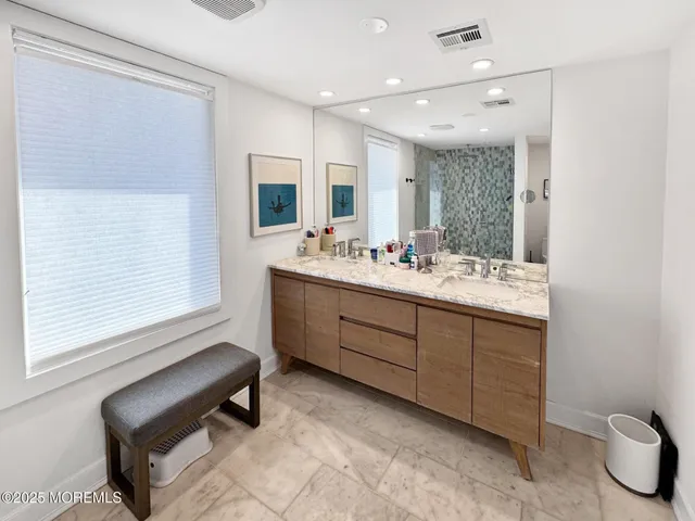 a bed room with two bed and a large mirror