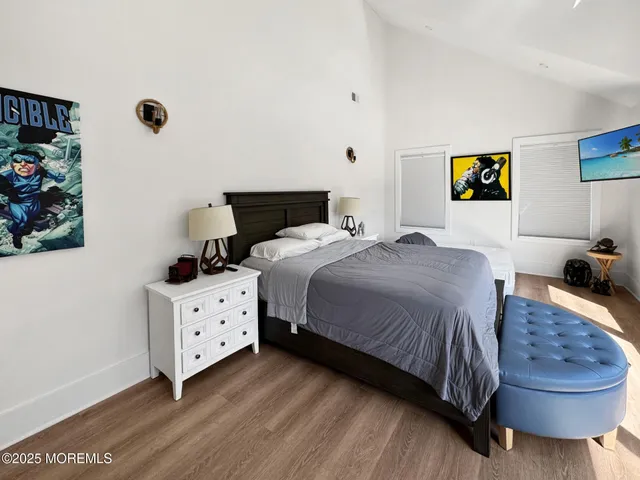 a bed room with a bed and a window