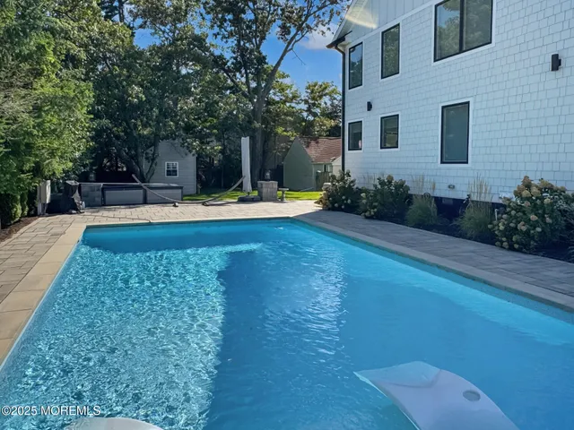 a view of a backyard with sitting area
