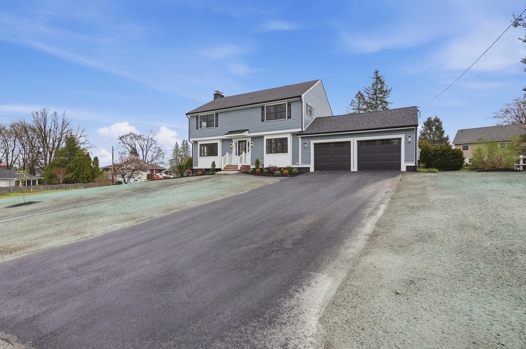 105 Stafford Road Lowell, MA 01852 - Photo 39 of 42 front view of a house with a street