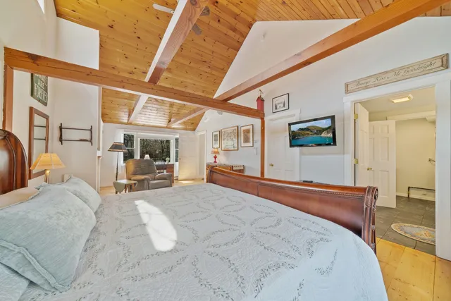 a large white bed in a white room