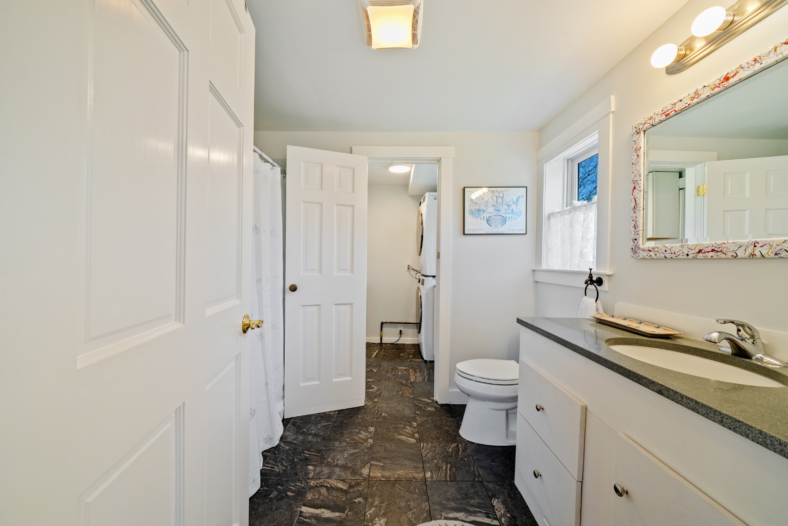 357 West Tisbury Road Edgartown, MA 02539 - Photo 15 of 33 a bathroom with a granite countertop sink a toilet a shower and a mirror