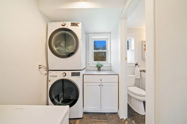 a view of bathroom with a washer and dryer