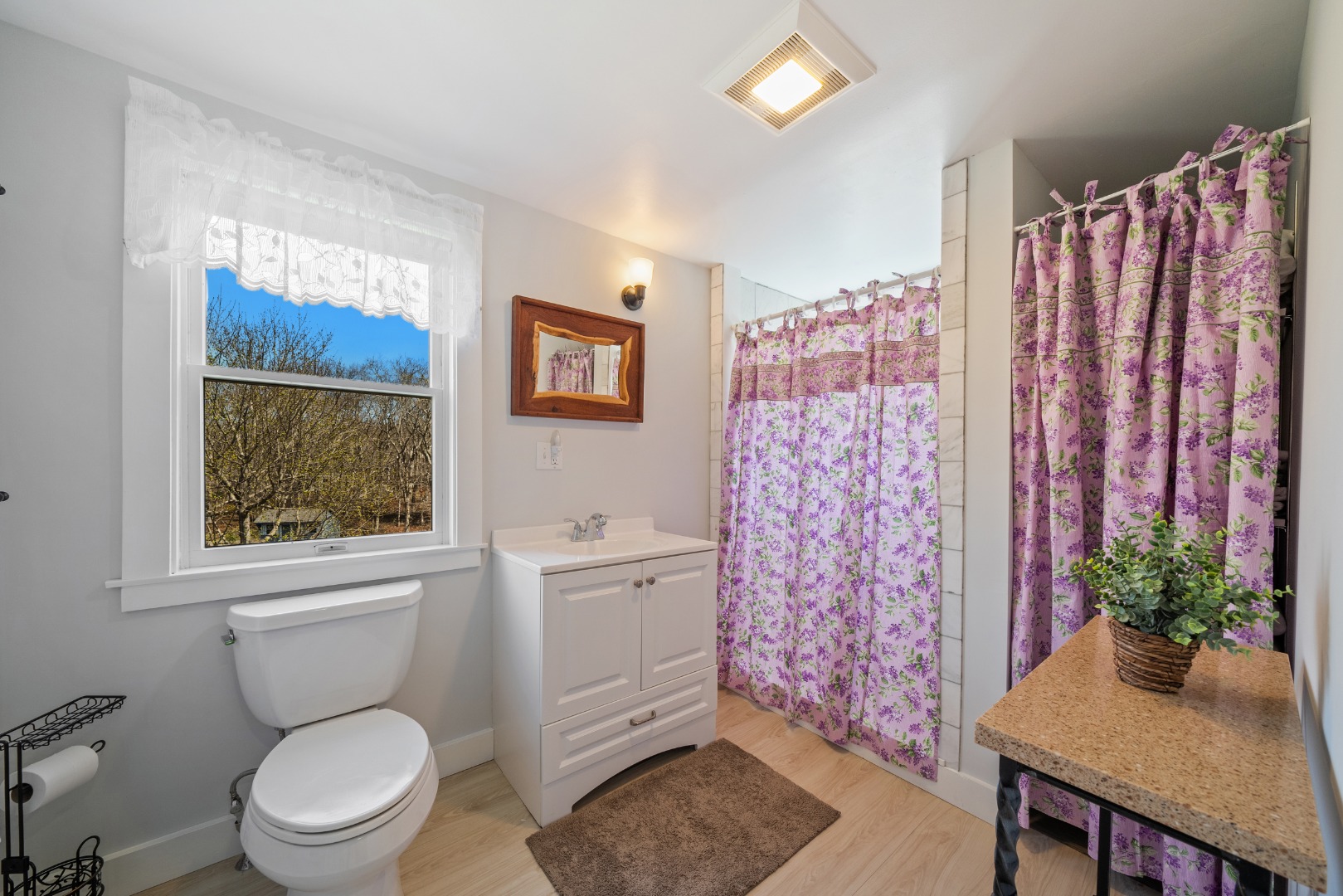 357 West Tisbury Road Edgartown, MA 02539 - Photo 20 of 33 a bathroom with a toilet a sink and a window