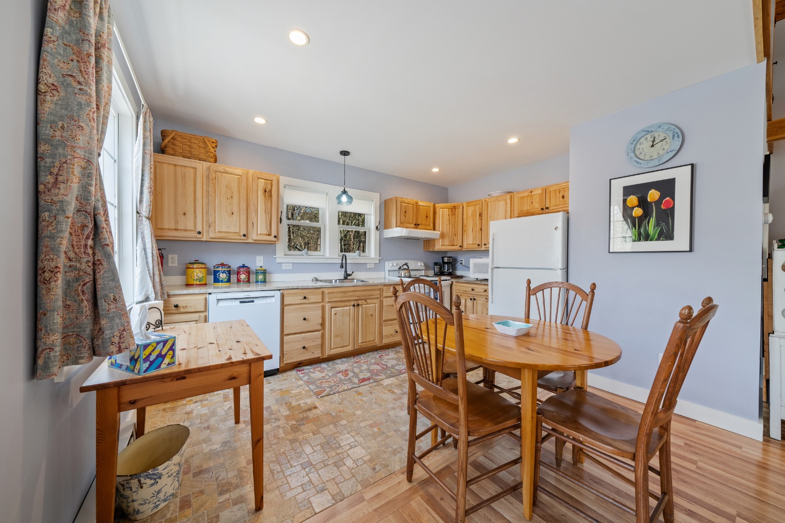 357 West Tisbury Road Edgartown, MA 02539 - Photo 21 of 33 a kitchen with kitchen island a dining table and chairs
