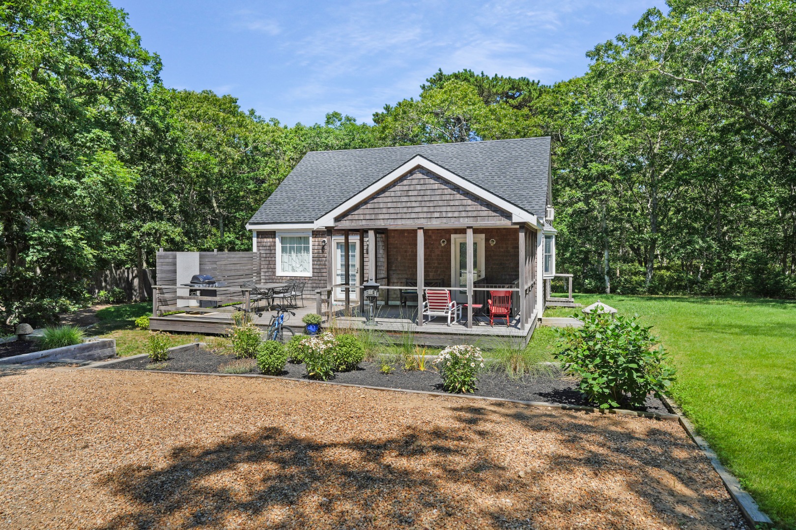 357 West Tisbury Road Edgartown, MA 02539 - Photo 22 of 33 a front view of a house with garden