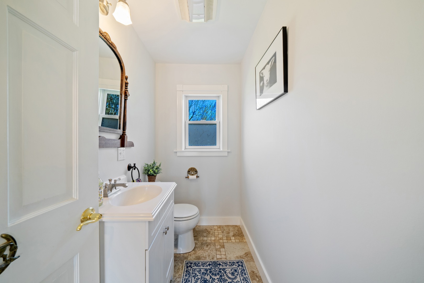 357 West Tisbury Road Edgartown, MA 02539 - Photo 6 of 33 a bathroom with a sink a toilet and mirror