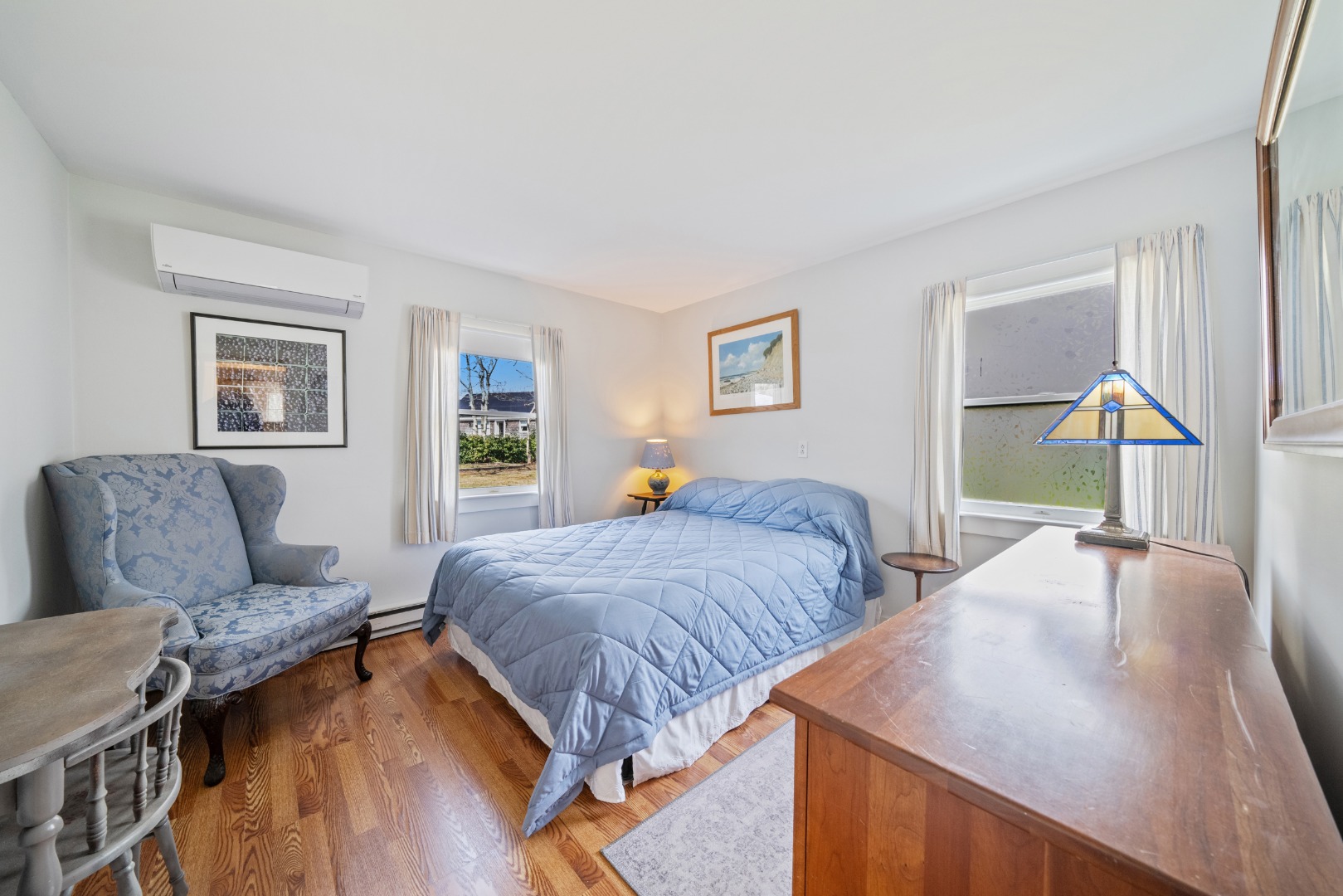 357 West Tisbury Road Edgartown, MA 02539 - Photo 8 of 33 a bedroom with two beds and a wooden floor