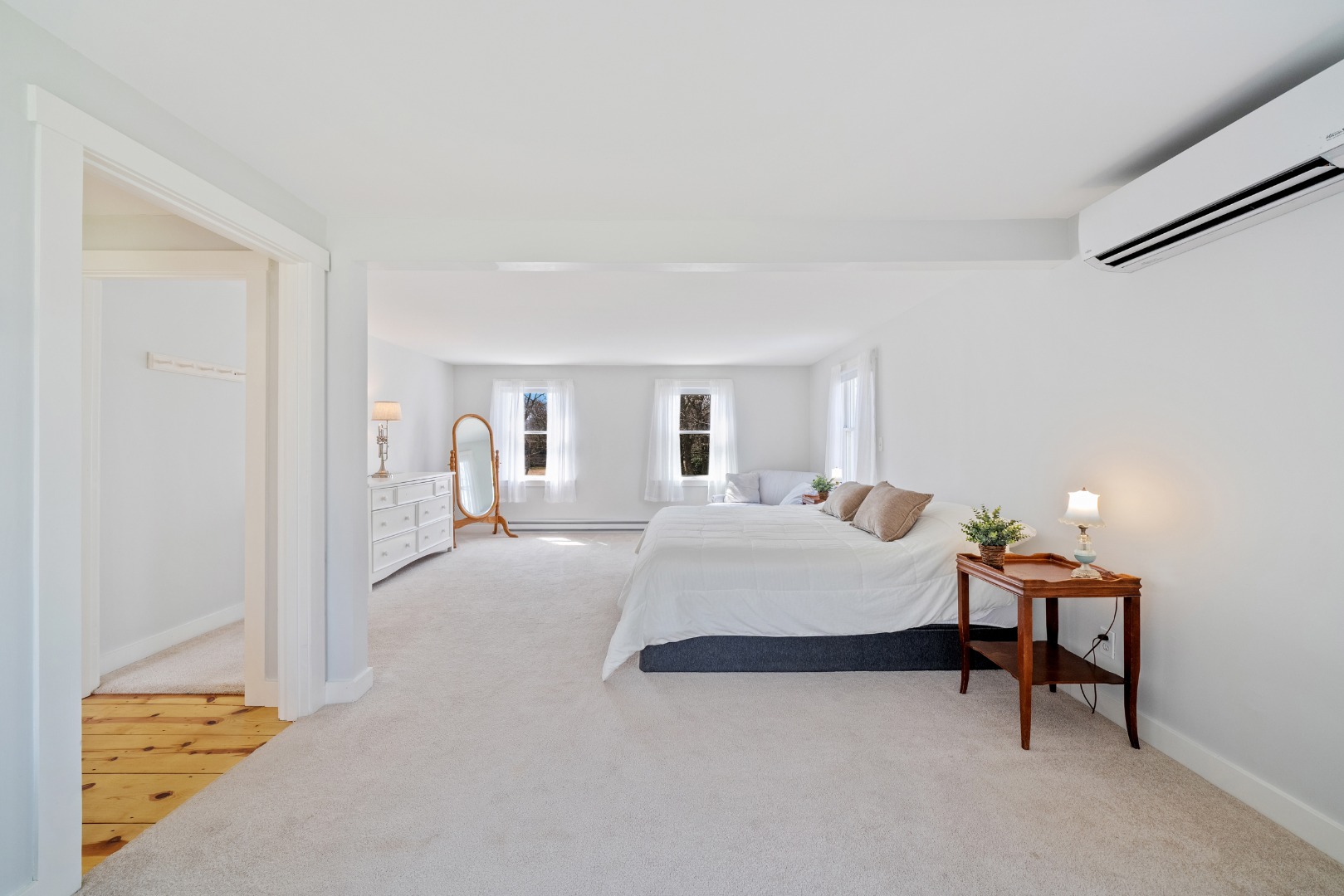 357 West Tisbury Road Edgartown, MA 02539 - Photo 10 of 33 a bedroom with a bed and a lamp with window