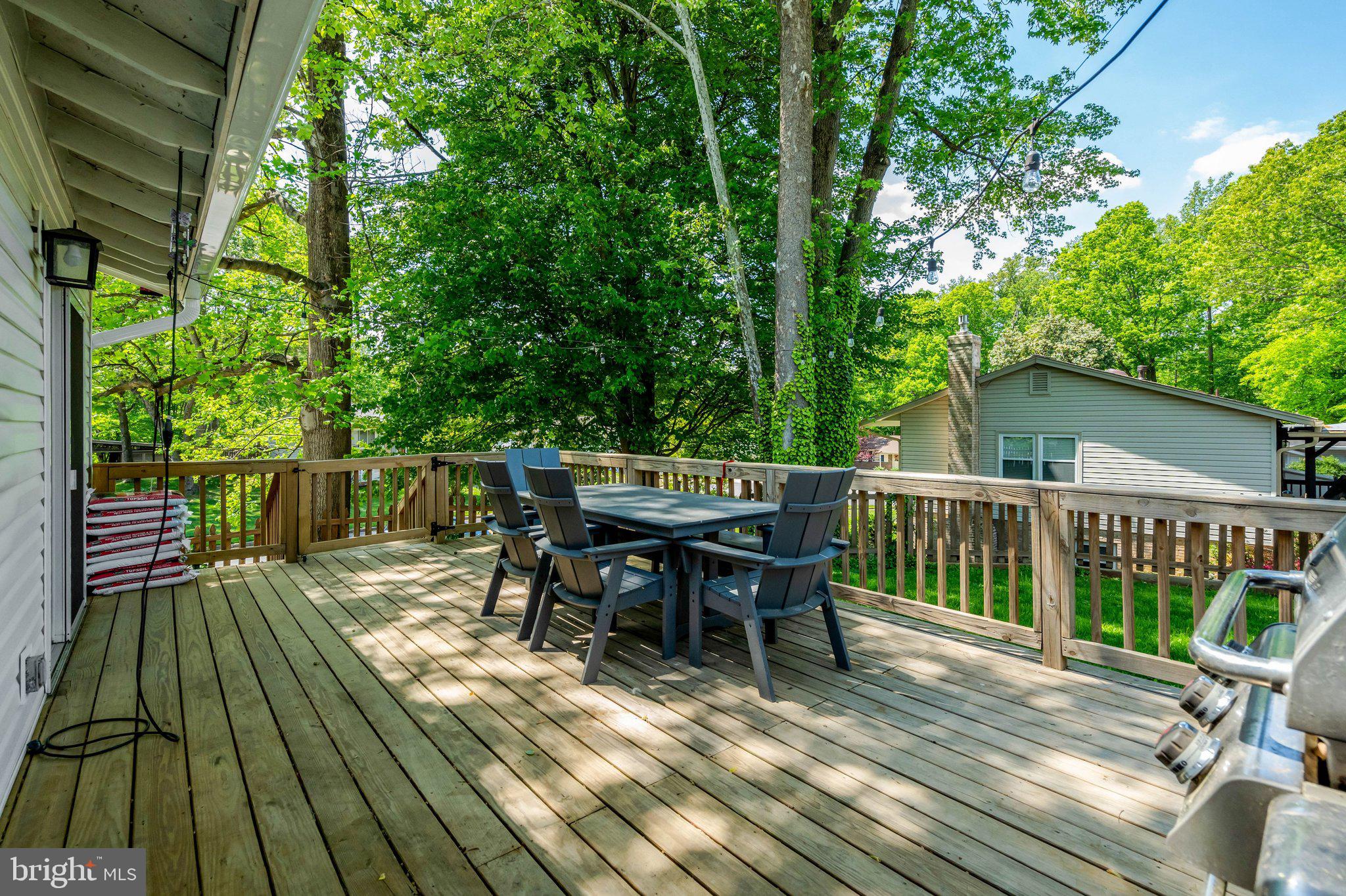 7212 Galgate Drive Springfield, VA 22153 - Photo 30 of 39 a view of a deck with furniture and trees