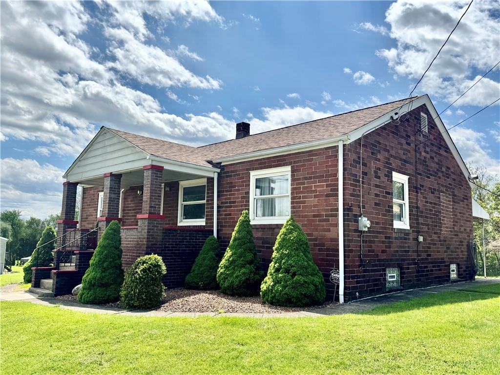 1111 Crowe Street New Castle, PA 16101 - Photo 1 of 37 a front view of a house with a yard