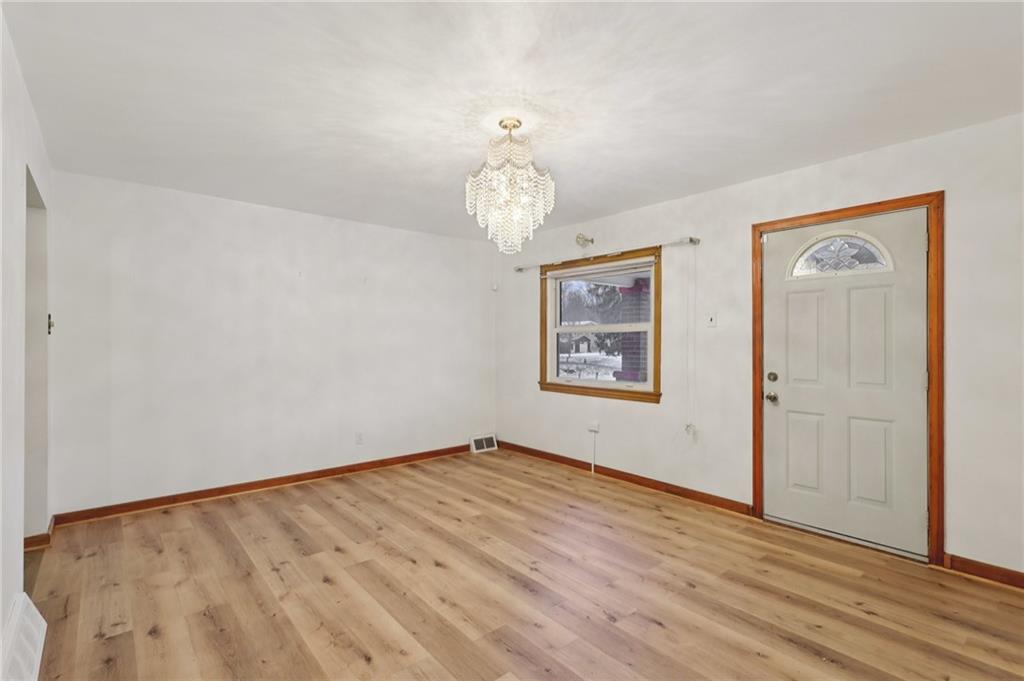 1111 Crowe Street New Castle, PA 16101 - Photo 6 of 37 a view of empty room with wooden floor