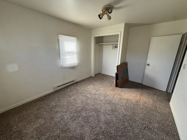 an empty room with a mirror