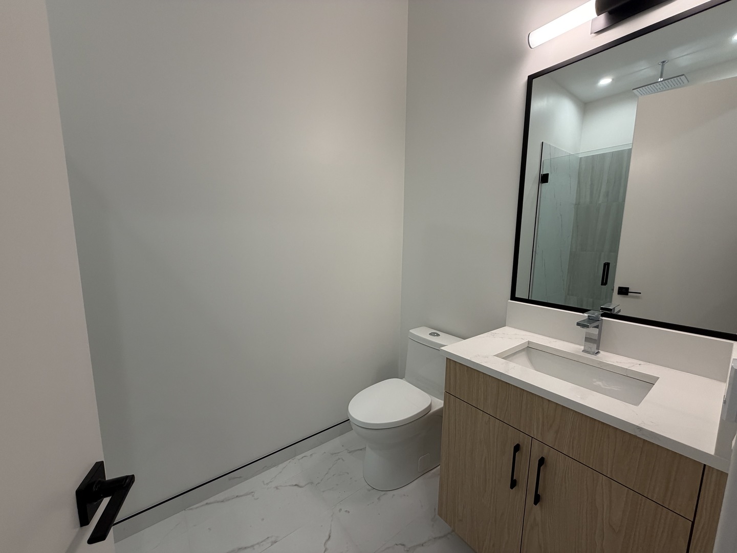 2127 West Madison Street, Unit 409 Chicago, IL 60612 - Photo 11 of 15 a bathroom with a sink and a toilet