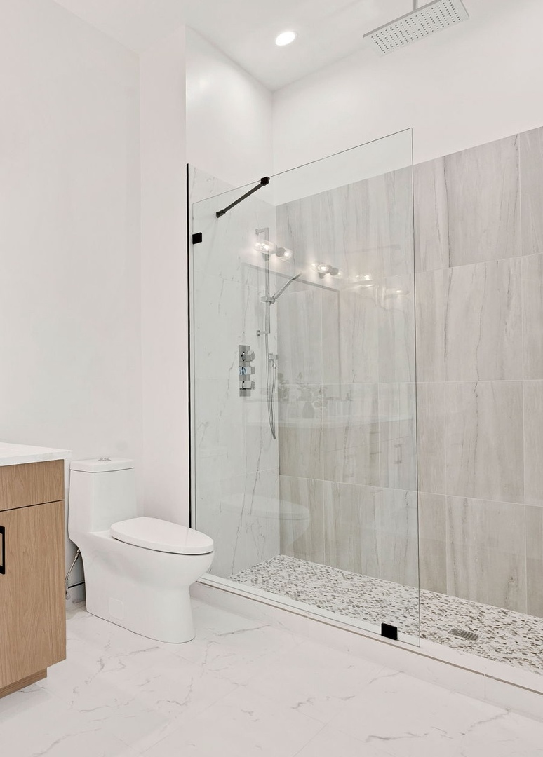 2127 West Madison Street, Unit 409 Chicago, IL 60612 - Photo 10 of 15 a bathroom with a toilet and a shower