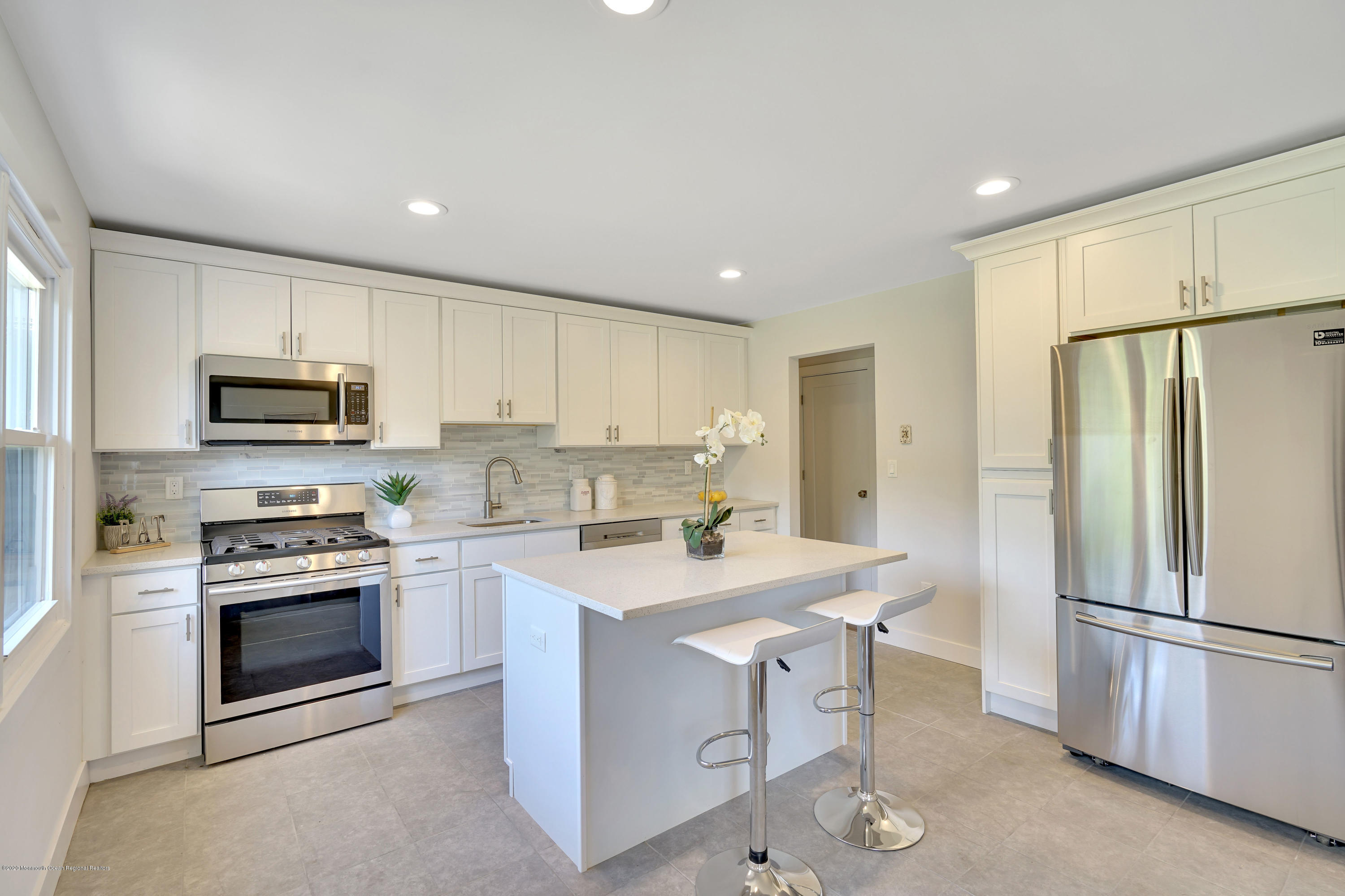 30 Jackson Mills Road Jackson, NJ 08527 - Photo 3 of 37 a kitchen with white cabinets stainless steel appliances and a refrigerator